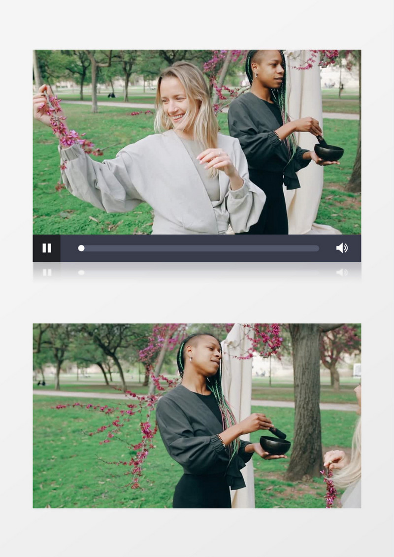 两个女人在草地上唱歌跳舞实拍视频素材