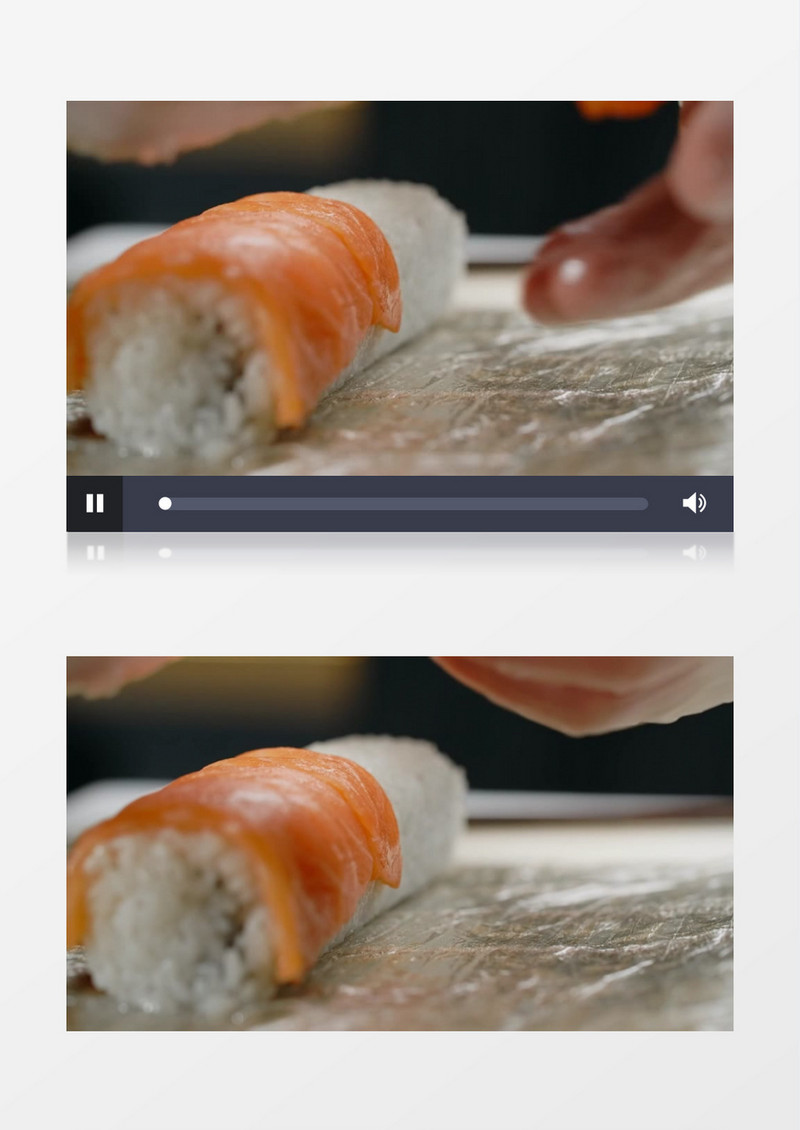 料理师在米饭卷上铺三文鱼实拍视频素材