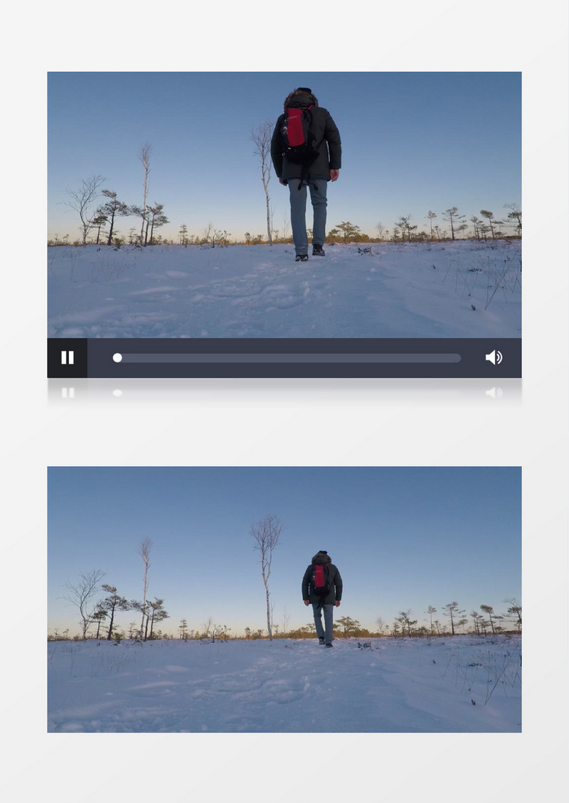 男子背包走在雪地上实拍视频素材