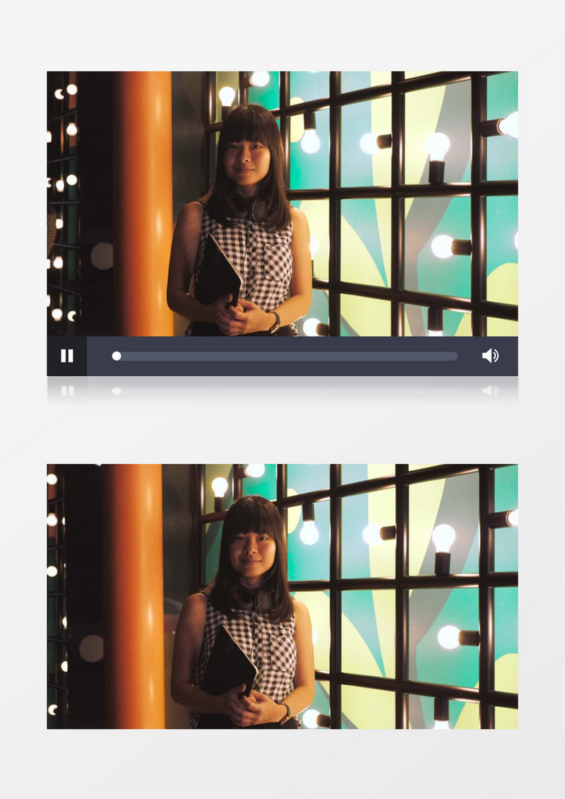  黑发美女拿着笔记本站在灯架前实拍视频素材