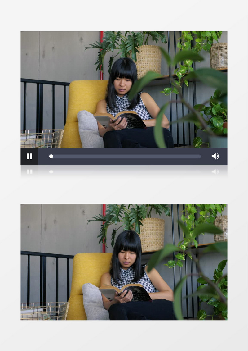 窝在沙发上看书的黑发女人实拍视频素材