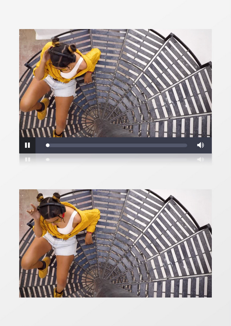 穿着黄衬衫的女孩戴着耳机坐在旋转楼梯上听音乐实拍视频素材