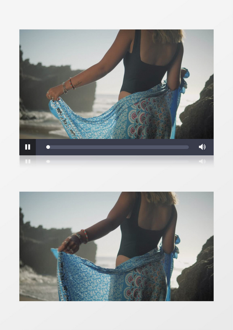 比基尼女孩围着沙滩巾站在海边玩水实拍视频素材