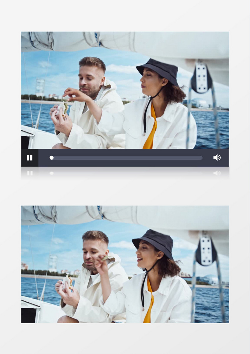 一对年轻男女坐在游艇上吃三明治实拍视频素材