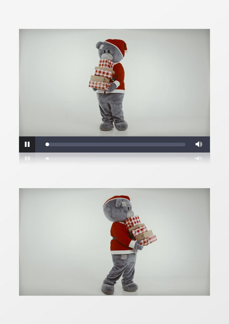 抱着礼物跳舞的圣诞节小熊实拍视频素材
