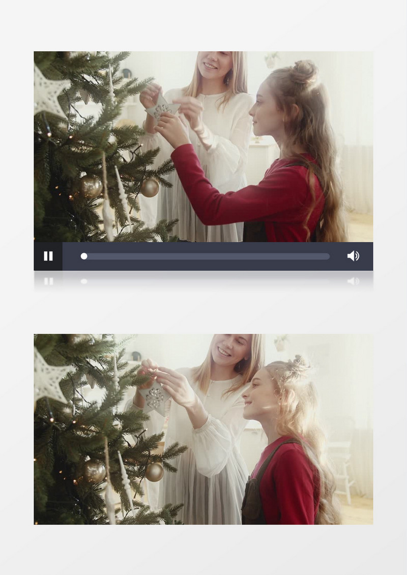 妈妈陪着女孩在装扮圣诞树实拍视频素材