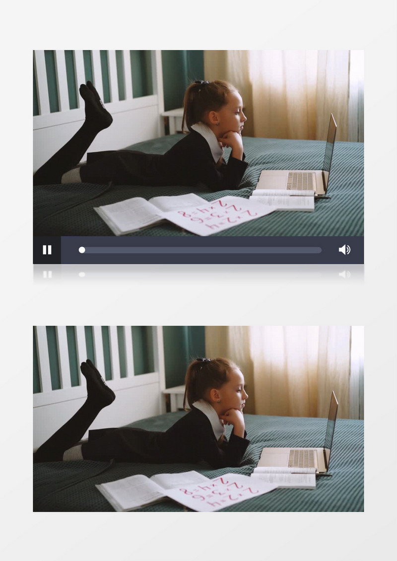 小女孩趴在床上看电脑实拍视频素材