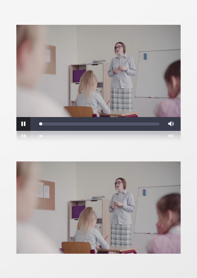 一个女老师站在白板前给学生上课实拍视频素材