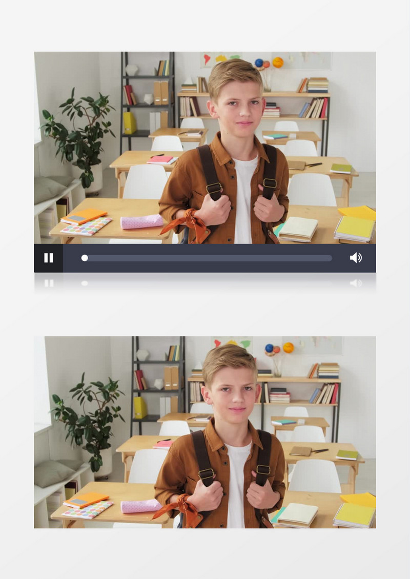 小男孩背着书包站在课桌旁边微笑实拍视频素材