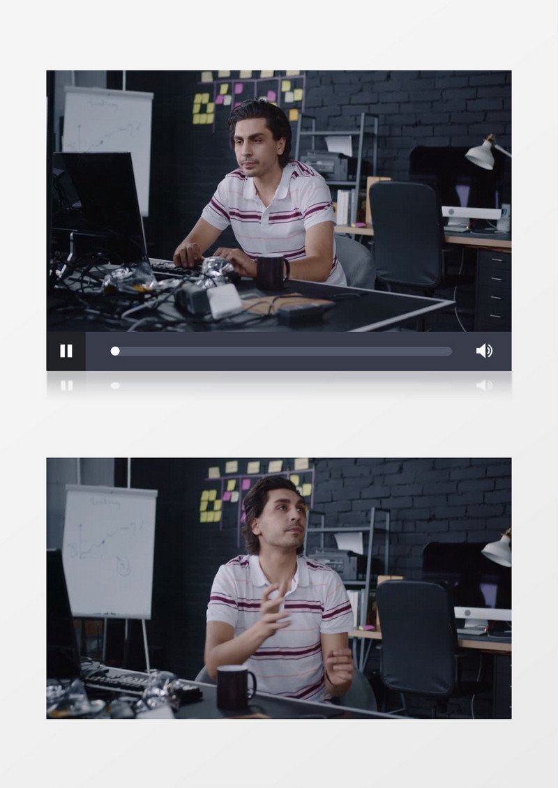 男人在电脑前打字并跟同事交谈实拍视频素材