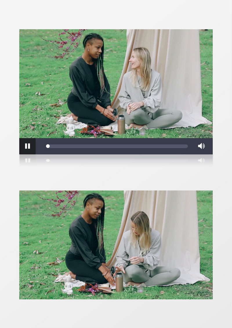 两个女人坐在草地上喝茶实拍视频素材
