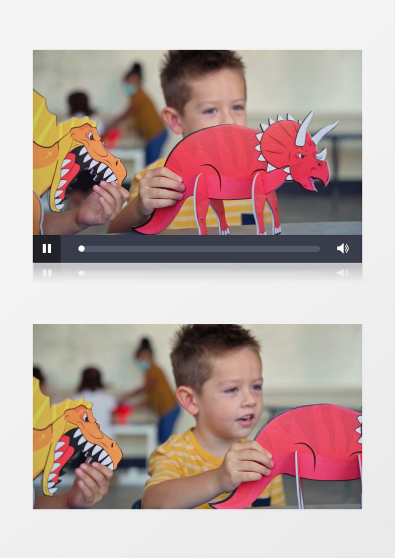 小男孩拿着恐龙纸板在玩耍实拍视频素材