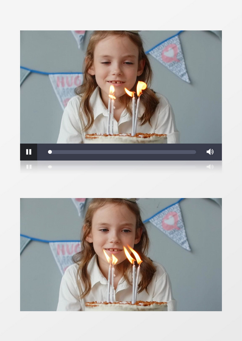 女孩在对着点燃生日蜡烛的蛋糕许愿实拍视频素材