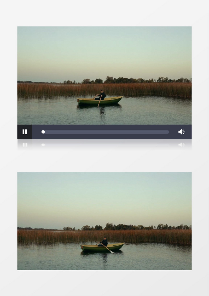 一个男人在平静的水面上划船实拍视频素材