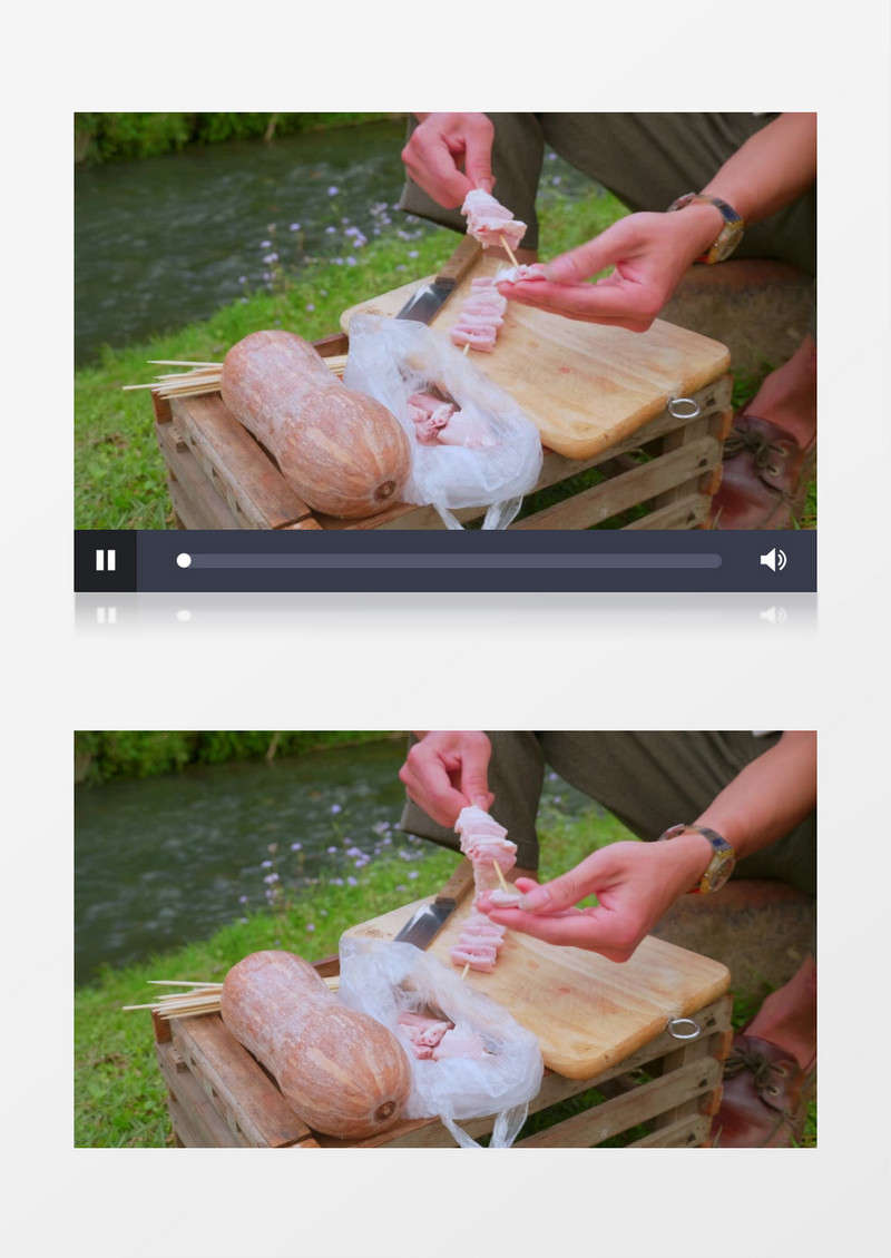 男人在烧烤签上串肉实拍视频素材
