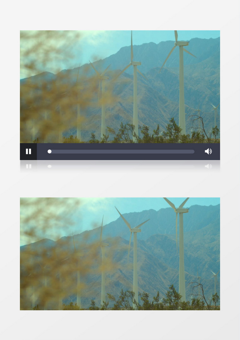 山脚下缓缓转动的风车实拍视频素材