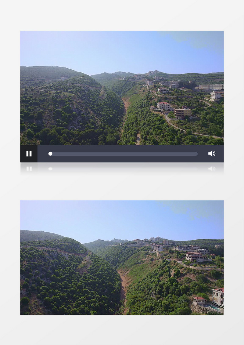 航拍山脉上的树木和山脚下的民居建筑实拍视频素材