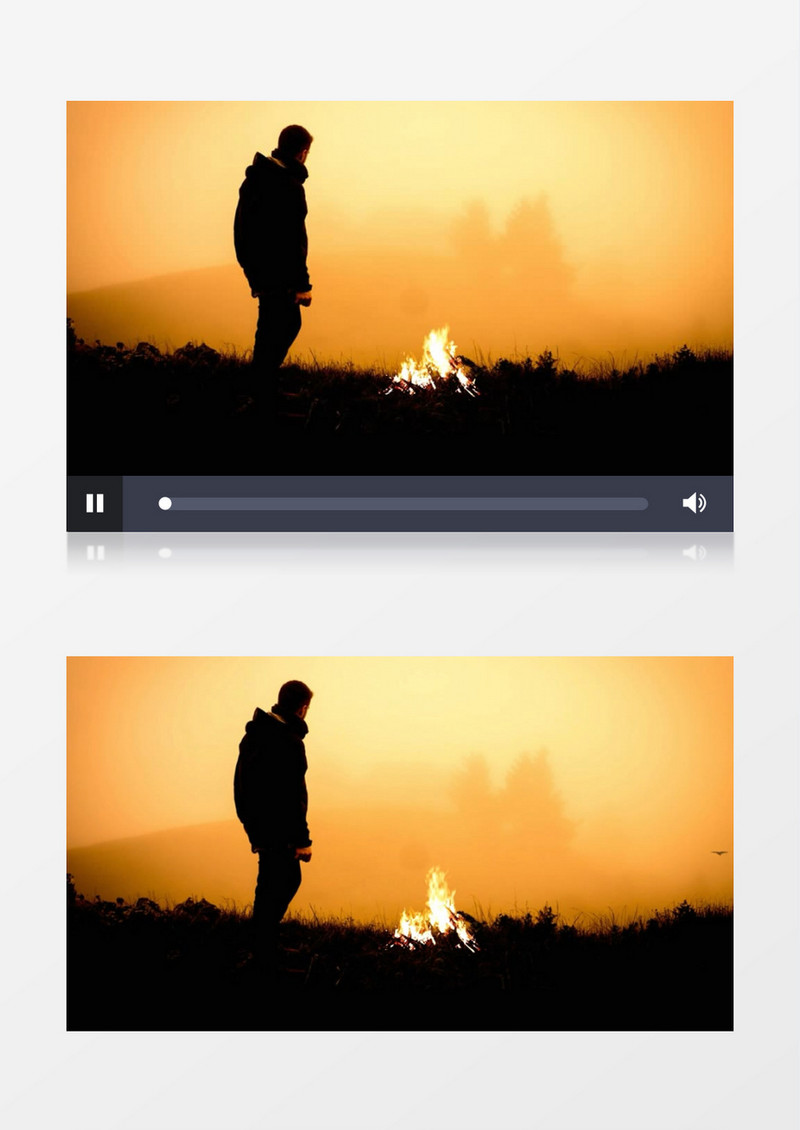 男人站在山顶上点着篝火眺望远方实拍视频素材