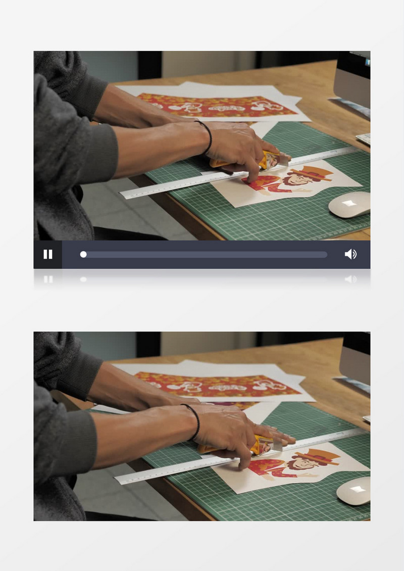 一名男子正在切一幅插画实拍视频素材