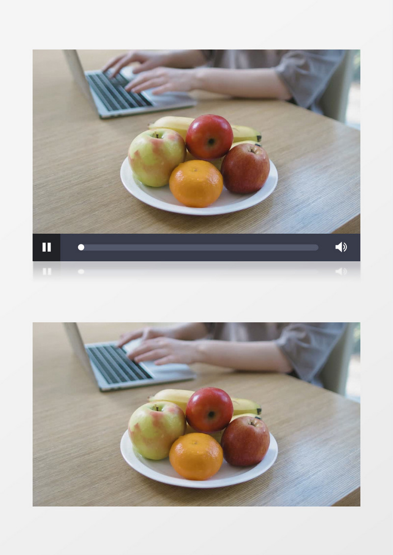 在桌上的盘子里拿水果吃实拍视频素材