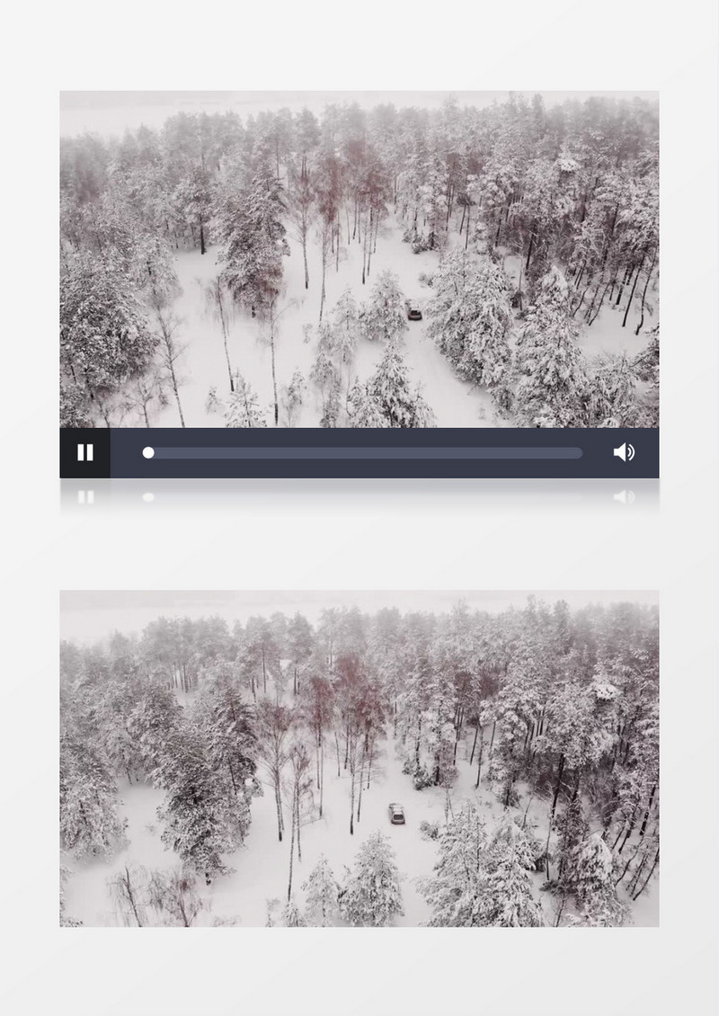 俯拍在雪林中缓缓行驶的汽车实拍视频素材