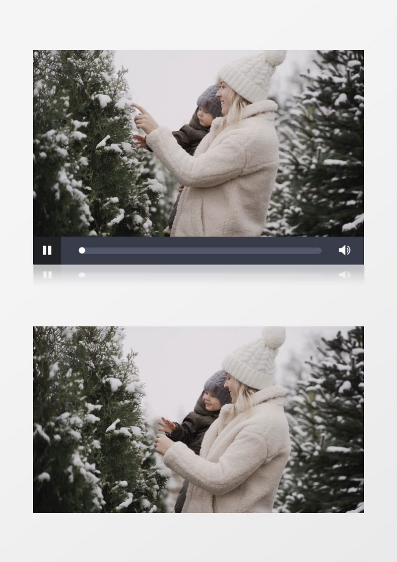 妈妈抱着宝宝在树前玩雪实拍视频素材