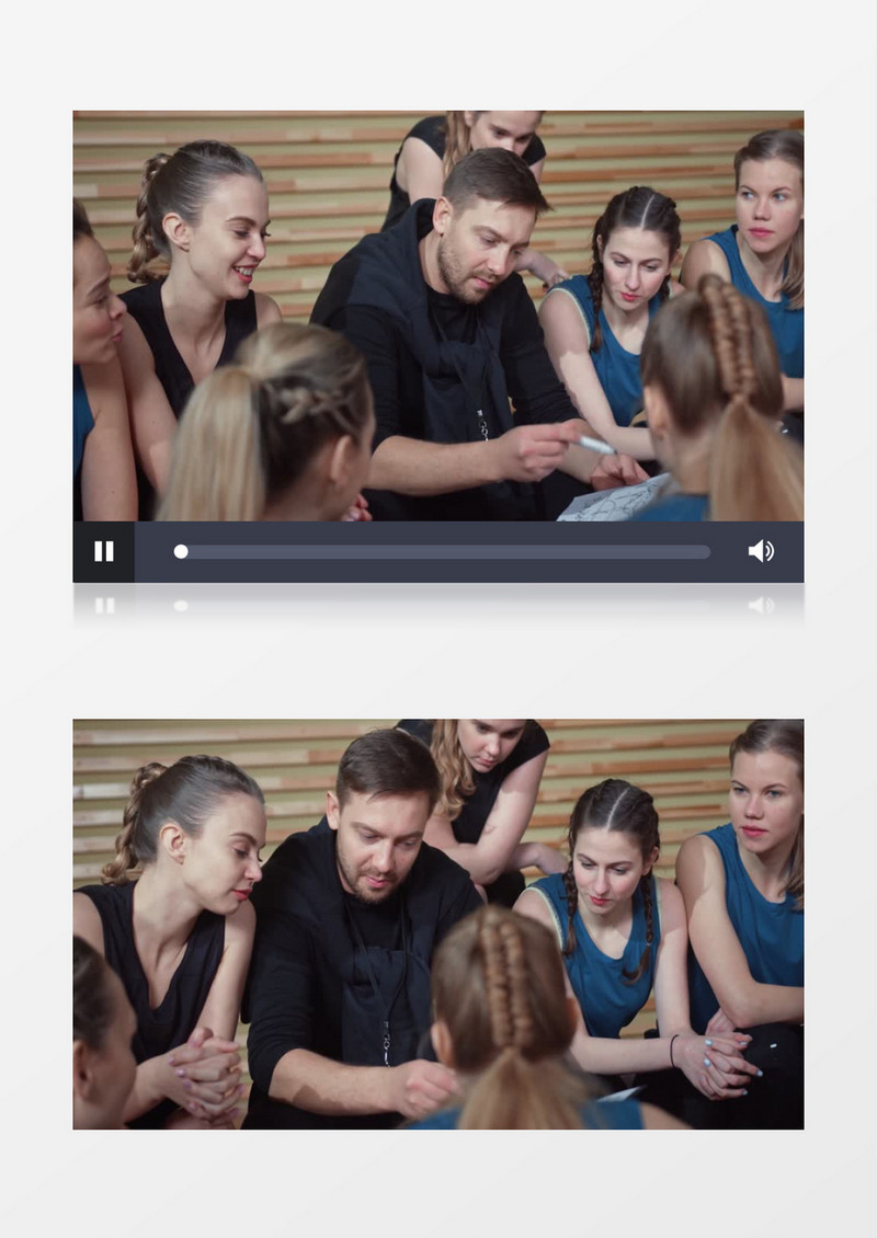 教练坐在运动员中间讲解题板上的案例实拍视频素材