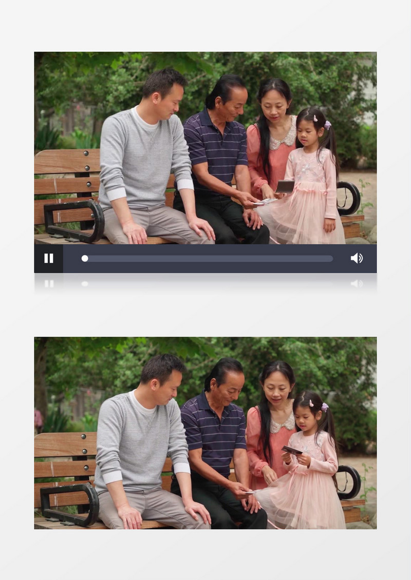 一家人坐在椅子上看照片实拍视频素材