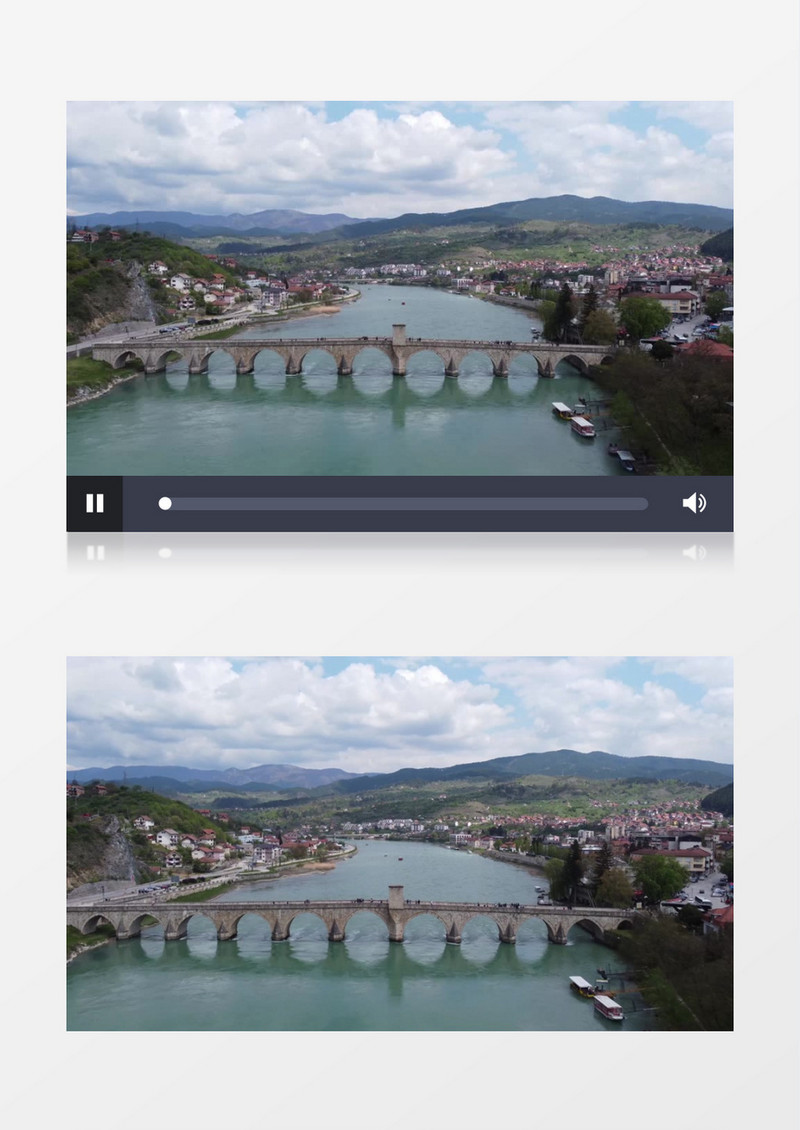 横跨河流的桥梁和河水两侧的城镇实拍视频素材