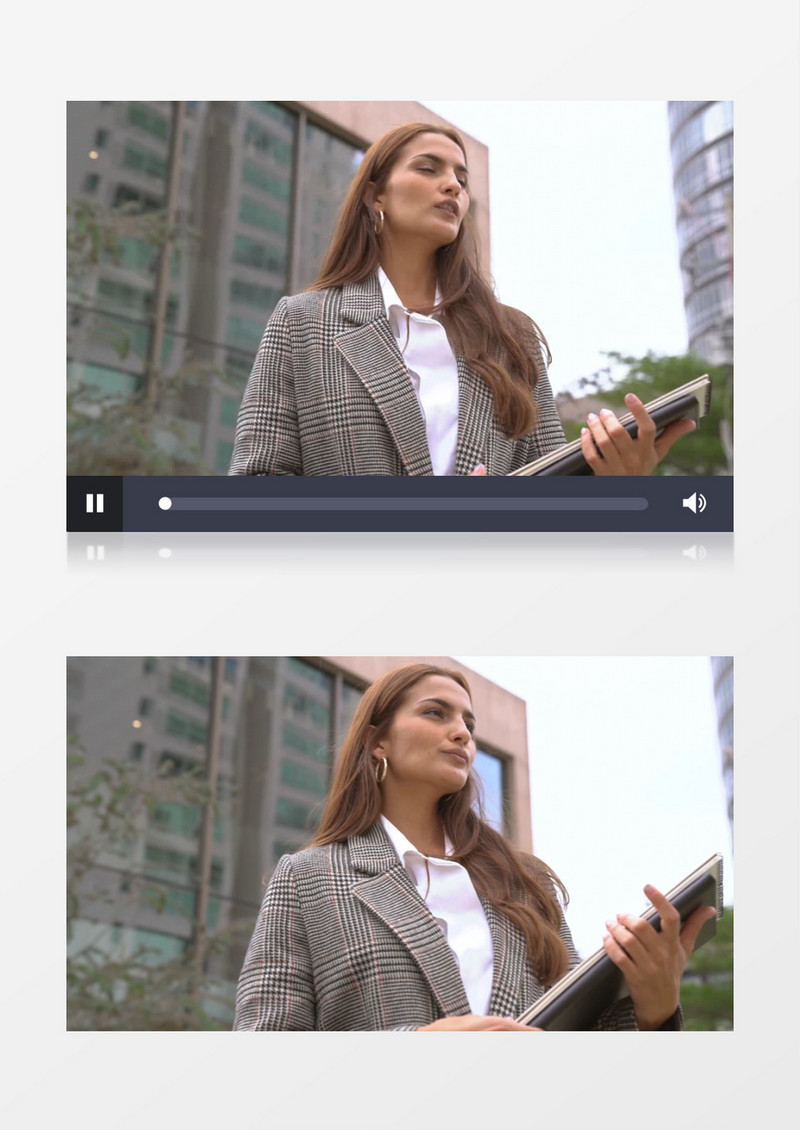 女白领拿着材料站立在办公楼前实拍视频素材