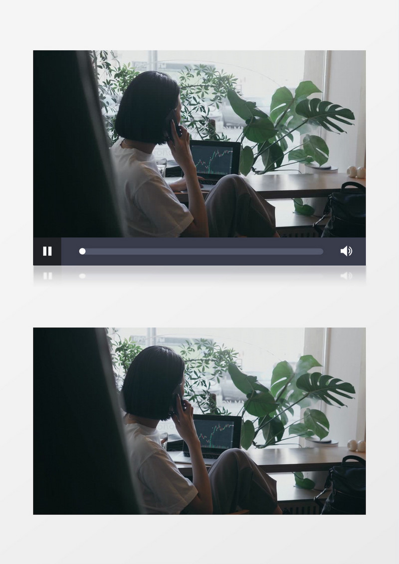 女士边看股票变化边打电话实拍视频素材